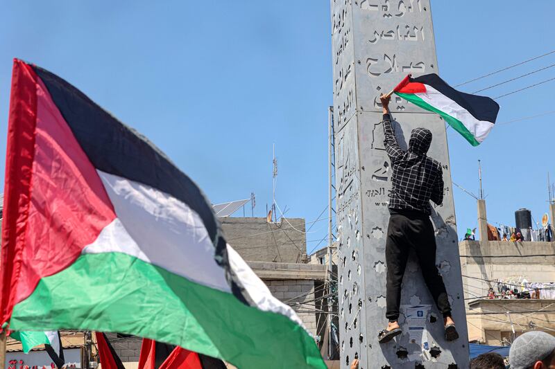 Supporters of the Hamas and Islamic Jihad groups rally after Friday prayers in Khan Yunis in the southern Gaza Strip, to express support for those at Al Aqsa Mosque. AFP