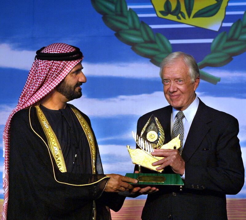 Sheikh Mohammed bin Rashid Al Maktoum, then Crown Prince of Dubai, presents the International Zayed Prize for the Environment to former US president Jimmy Carter in Dubai on April 22 2001. AFP