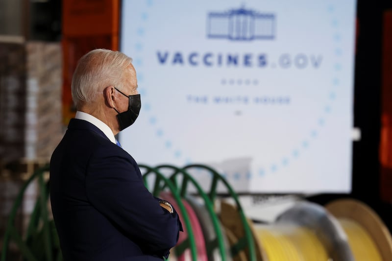 US President Joe Biden stands before delivering remarks on the importance of Covid-19 vaccine requirements, during his visit at a Clayco construction site, in Elk Grove Village, Illinois, US, on October 7, 2021. Reuters