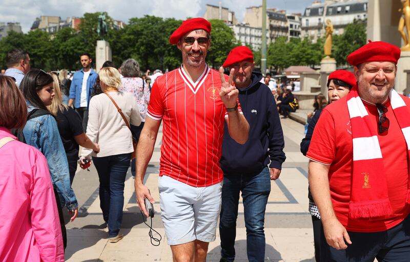 A Liverpool fan, wearing a red beret. Getty