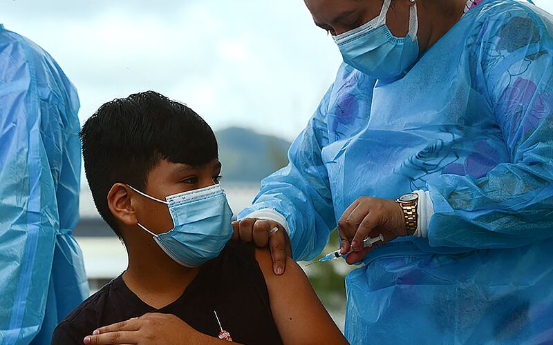 A boy receives the first dose of the Pfizer/BioNTech Covid-19 vaccine in Tegucigalpa. AFP