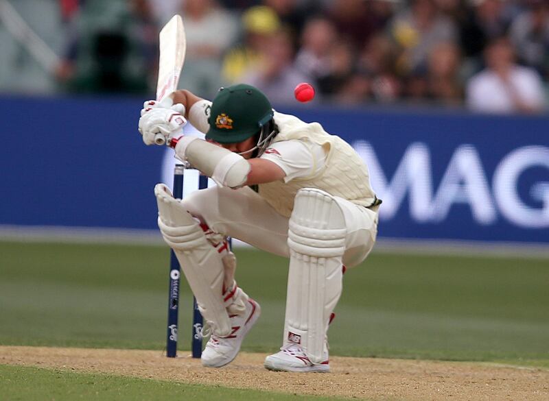 Australia's Pat Cummins ducks to avoid a delivery from England's Stuart Broad during the second day of their Ashes test match in Adelaide. Rick Rycroft / AP Photo