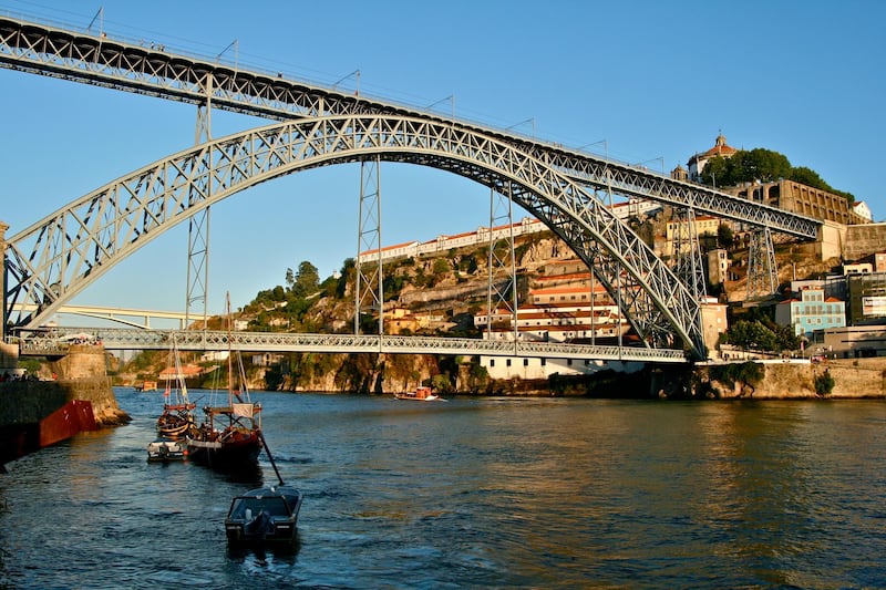 The Dom Luis bridge is one of five that straddle the River Douro running through the heart of Porto. Courtesy Wikimedia Commons 