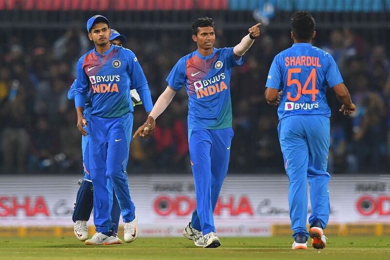 India bowler Navdeep Saini, centre, celebrates after taking the wicket of Sri Lanka's Danushka Gunathilaka. AFP