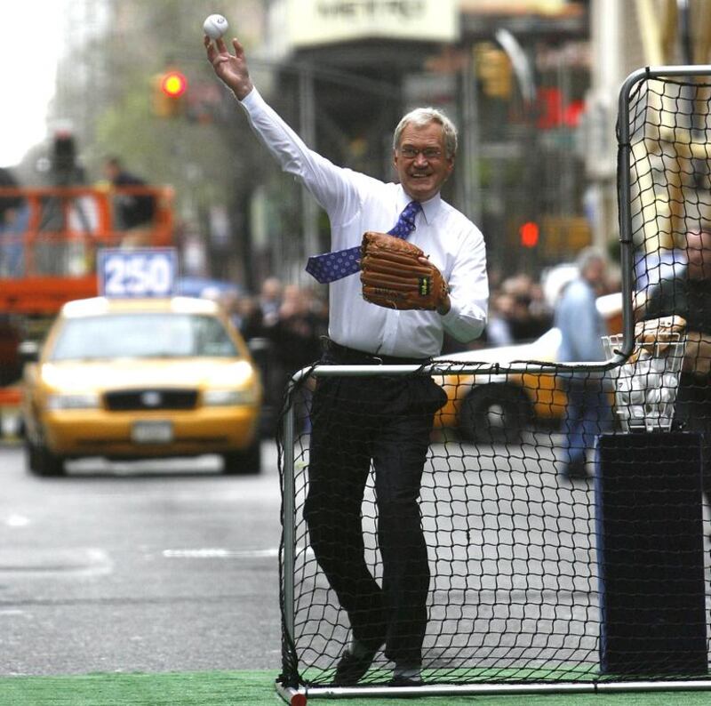 David Letterman throwing a pitch to New York Mets third baseman David Wright outside the Late Show with David Letterman. AP