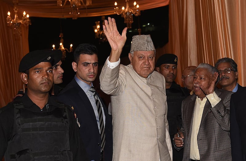 Indian politician Farooq Abdullah (C) walking into the wedding reception of Isha Ambani. Photo: AFP