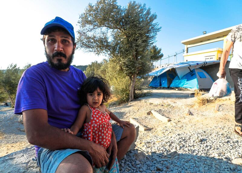 Marmaro, Mytilene, Greece, September 12, 2018.  The Moria "Open" refugee camp. --   Ahmed and his daughter, Fatima- 2, from Baghdad, Iraq.
Victor Besa/The National
Section:  WO
Reporter:  Anna Zacharias