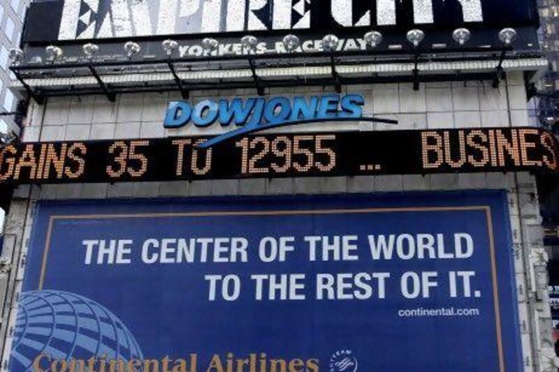 The Dow Jones "Zipper" in Times Square in New York shows the Dow Jones Industrial Average at 12,955, slightly above its close at 12,953.94, Tuesday, April 24, 2007. Most U.S. stocks declined after consumer confidence and home sales trailed forecasts, reviving concern the economy is slowing. An expanded share repurchase by International Business Machines Corp. lifted the Dow Jones Industrial Average to its eighth gain in nine days. Photographer: David Karp/Bloomberg News.