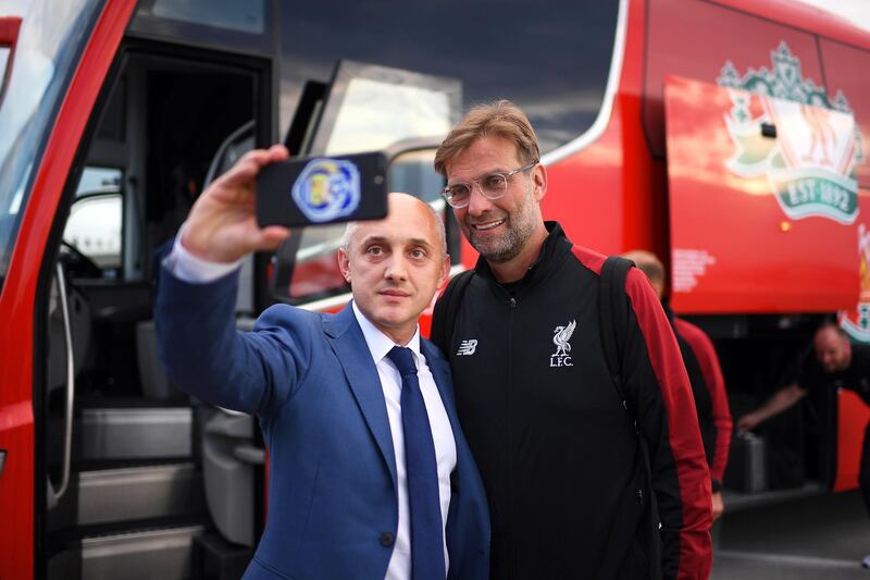 A handout photo made available by the UEFA of Liverpool's manager Juergen Klopp (R) posing for a selfie as he arrives ahead of the UEFA Champions League final at IEV Airport in Kiev, Ukraine.  EPA / UEFA / HANDOUT