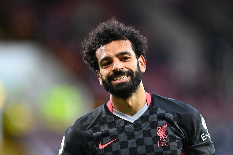 Liverpool's Egyptian midfielder Mohamed Salah reacts during the English Premier League football match between Burnley and Liverpool at Turf Moor in Burnley, north west England on May 19, 2021. RESTRICTED TO EDITORIAL USE. No use with unauthorized audio, video, data, fixture lists, club/league logos or 'live' services. Online in-match use limited to 120 images. An additional 40 images may be used in extra time. No video emulation. Social media in-match use limited to 120 images. An additional 40 images may be used in extra time. No use in betting publications, games or single club/league/player publications.
 / AFP / POOL / Clive Mason / RESTRICTED TO EDITORIAL USE. No use with unauthorized audio, video, data, fixture lists, club/league logos or 'live' services. Online in-match use limited to 120 images. An additional 40 images may be used in extra time. No video emulation. Social media in-match use limited to 120 images. An additional 40 images may be used in extra time. No use in betting publications, games or single club/league/player publications.
