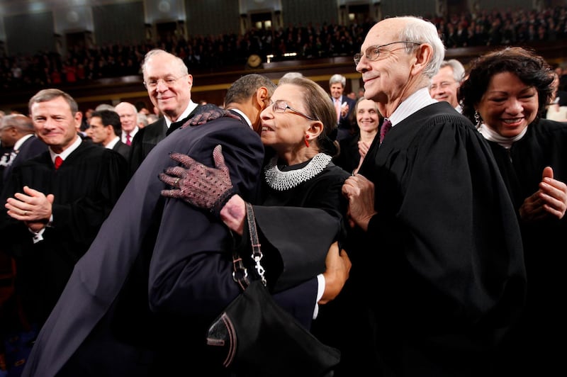President Barack Obama hugs Supreme Court Justice Ruth Bader Ginsburg on Capitol Hill in Washington,  prior to delivering his State of the Union address. From left are, Chief Justice John Roberts, Justice Anthony Kennedy, Obama, Justice Ginsburg and Justice Stephen Breyer.  AP