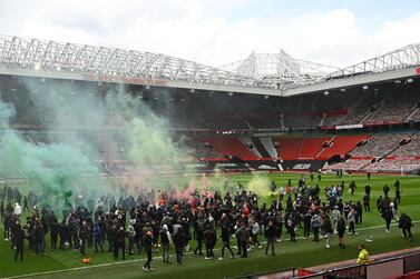 Supporters protest against Manchester United's owners, inside English Premier League club Manchester United's Old Trafford stadium in Manchester, north west England on May 2, 2021, ahead of their English Premier League fixture against Liverpool. Manchester United were one of six Premier League teams to sign up to the breakaway European Super League tournament. But just 48 hours later the Super League collapsed as United and the rest of the English clubs pulled out. / AFP / Oli SCARFF