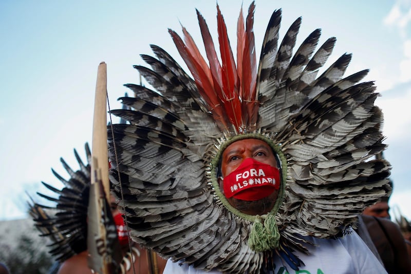 Indigenous Brazilians stage protest against their country hosting the Copa America football tournament in Brazil. Reuters