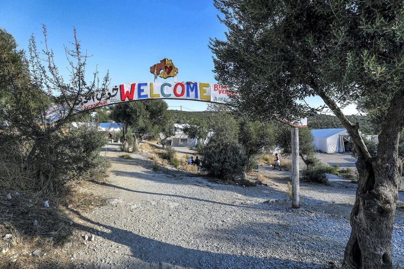 Marmaro, Mytilene, Greece, September 12, 2018.  The Moria "Open" refugee camp. --  The main entrance arch of the Moria "open" camp.  One of the many pathways of the camp. 
Victor Besa/The National
Section:  WO
Reporter:  Anna Zacharias