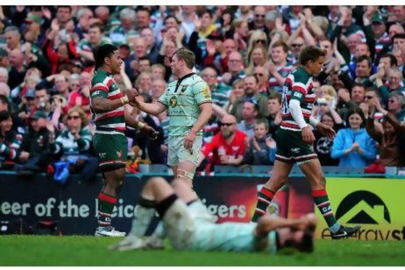 Chris Ashton, centre, and Manu Tuilagi embrace at the final whistle of the match between Leicester Tigers and Northampton Saints last Saturday, despite the latter landing three punches on the Saints player’s head during the game.