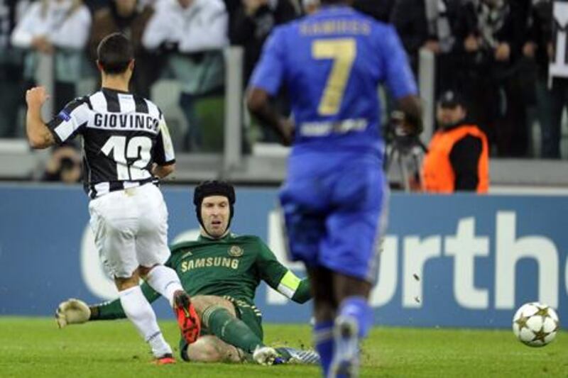 Juventus' Sebastian Giovinco knocks the ball past an outrushing Petr Cech to score the third against Chelsea.