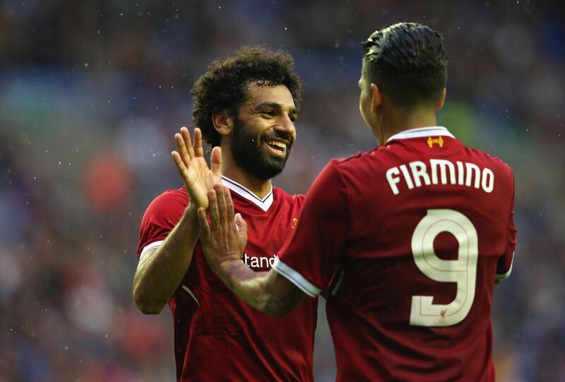 WIGAN, ENGLAND - JULY 14:  Mohamed Salah of Liverpool celebrates with Roberto Firmino after scoring their first goal during the pre-season friendly match between Wigan Athletic and Liverpool at DW Stadium on July 14, 2017 in Wigan, England.  (Photo by Alex Livesey/Getty Images)