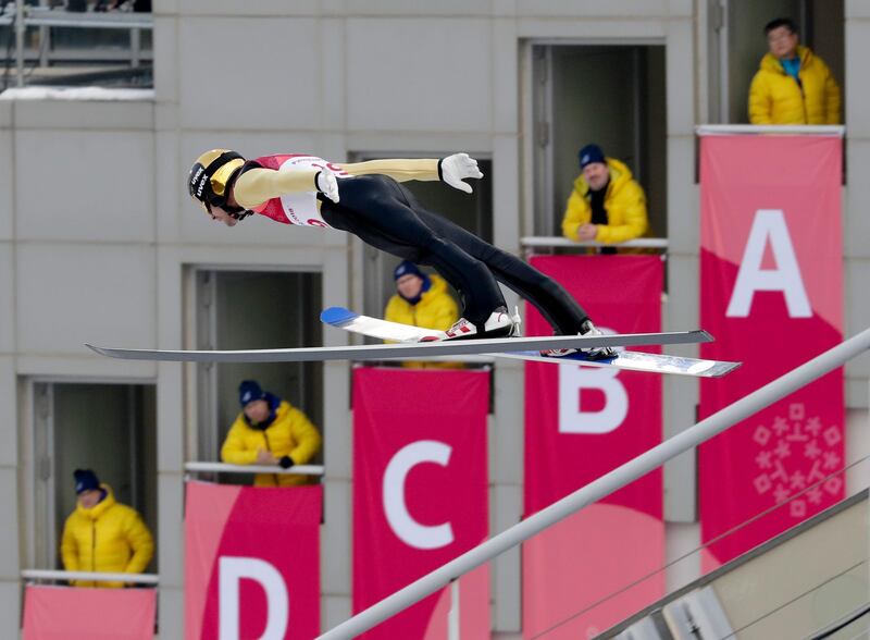 Lukas Klapfer, of Austria, soars through the air during the competition jump in the nordic combined event at the 2018 Winter Olympics in Pyeongchang. Dmitri Lovetsky / AP Photo