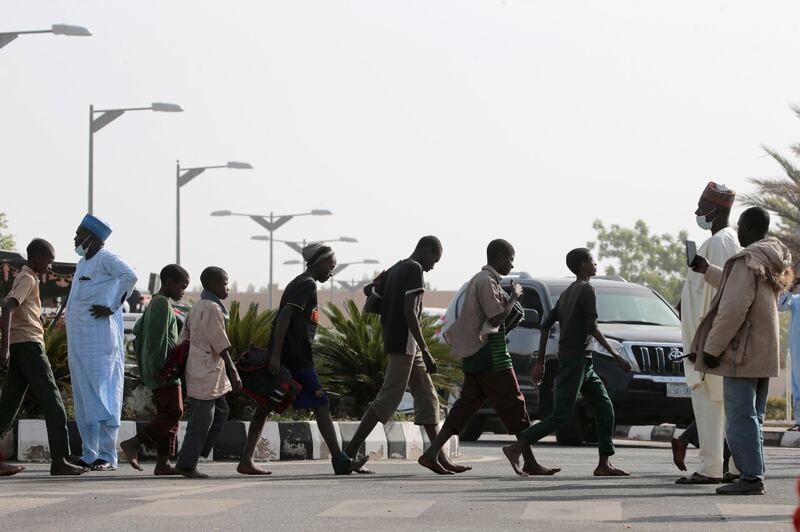 Freed Nigerian schoolboys walk after they were rescued by security forces in Katsina, Nigeria. REUTERS