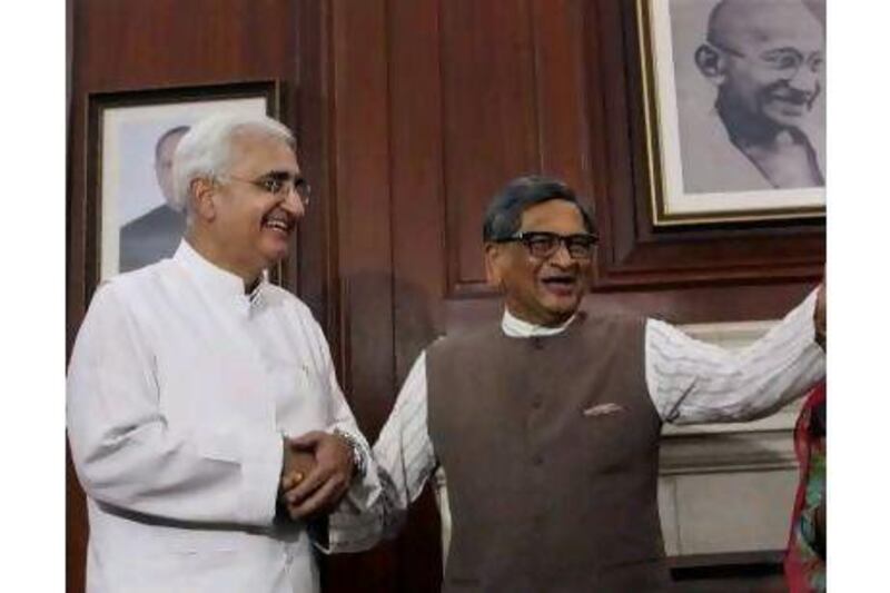 A reader says Salman Khurshid (on left, with former Indian foreign minister SM Krishna) has a big job ahead of him. AP