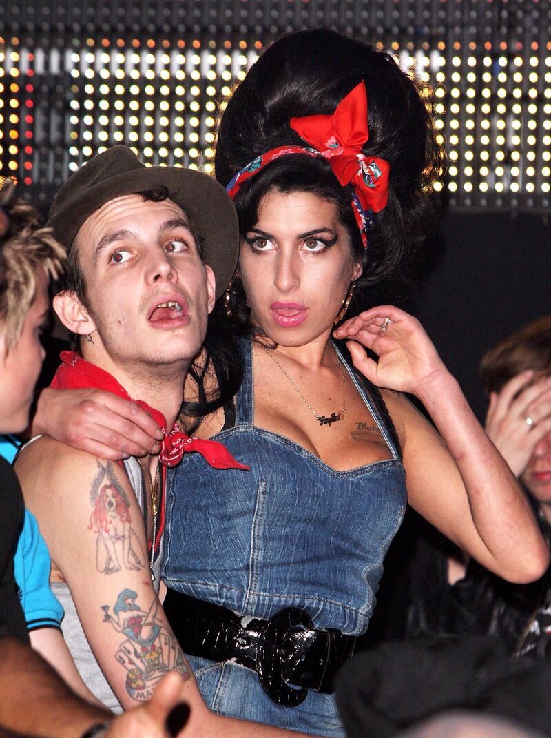 MUNICH, GERMANY - FILE:  (UK TABLOID NEWSPAPERS OUT)  Amy Winehouse and husband Blake Fielder-Civil watch the show at the MTV Europe Music Awards 2007 at the Olympiahalle on November 1, 2007 in Munich, Germany. Winehouse has been found dead in her flat in North London on July 23, 2011.   (Photo by Dave Hogan/Getty Images for MTV) *** Local Caption ***  504652015.jpg