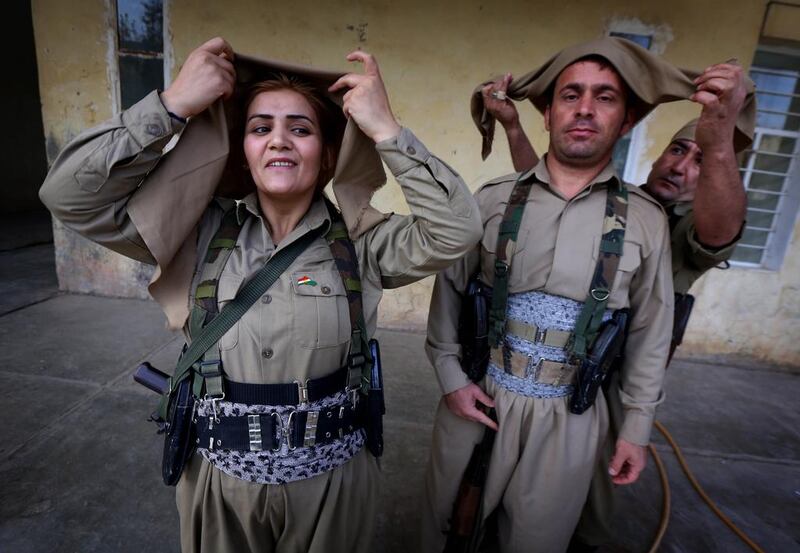 Iranian Kurdish Peshmerga members of the Kurdistan Democratic Party of (KDP-Iran) get ready during routine military exercises in Koya, 100 kms north of Arbil, the capital of the autonomous Kurdish region of northern Iraq. Safin Hamed / AFP 