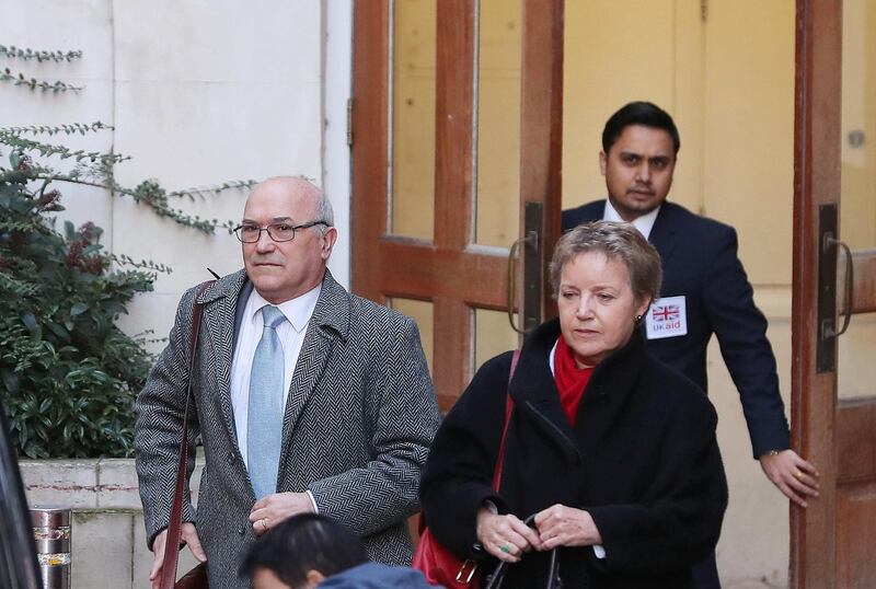 epa06518065 The Oxfam Charity's CEO Mark Goldring  (L) and Chair Caroline Thomson  (R) leave the Department of International Trade and Development in London, Britain, 12 February 2018. Oxfam is engulfed in a scandal in which worker are alleged to have paid prostitutes for sex in the aftermath of the 2010 earthquake in Haiti.  EPA/STR