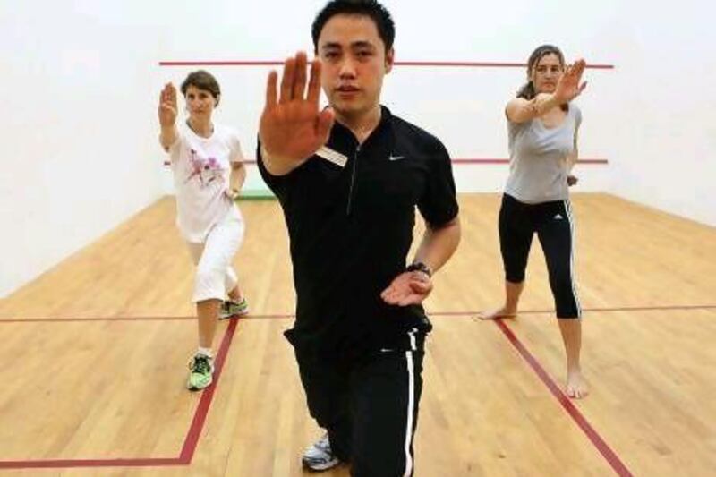 The fitness instructor, Paulo Bautista, teaches Yi Lu Quan at the Abu Dhabi Golf Club. Fatima Al Marzooqi / The National