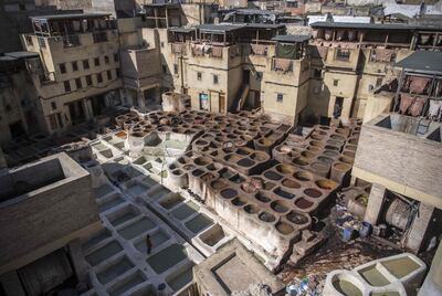A view of the tannery in the 9th century walled medina in the ancient Moroccan city of Fez on April 11, 2019. In recent times the imperial city of Fez has been overlooked by tourists in favour of Marrakesh, but now Morocco's 'spiritual' capital is bustling with visitors thanks to major renovations and low-cost flights. Since 2013, more than one billion dirhams (92 million euros) of investments have been poured into Fez to restore the 9th century walled medina and develop tourism. / AFP / FADEL SENNA
