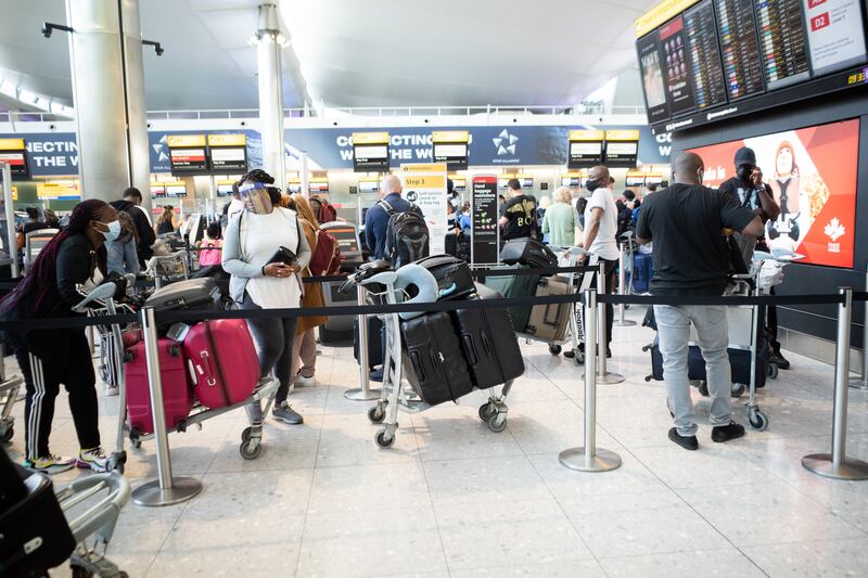 Passengers queue at departures in Terminal 2 of Heathrow Airport in London. All photos: Mark Chilvers for The National