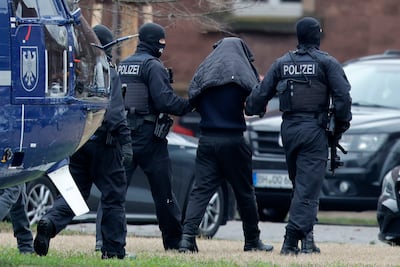 Police lead two suspects allegedly connected to Hamas to court in Karlsruhe, Germany. EPA
