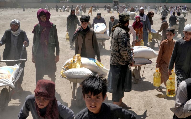People receive food rations in Kabul last April. Like Afghanistan, several poor countries are reliant on wheat delivered from Ukraine. AP