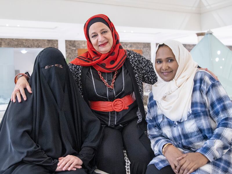 Dalal Abu Hamam, centre, with Nesreen Hassan, left, and Fadwa Hussein at the Friends of Cancer Patients in Sharjah. Leslie Pableo for The National