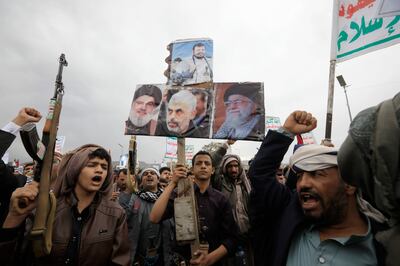 Houthi supporters hold up posters depicting the Houthis' top leader Abdul-Malik Al Houthi, Iran's Supreme Leader Ali Khamenei, Hamas' chief in Gaza Yahya Sinwar, and the leader of Hezbollah Hassan Nasrallah. EPA