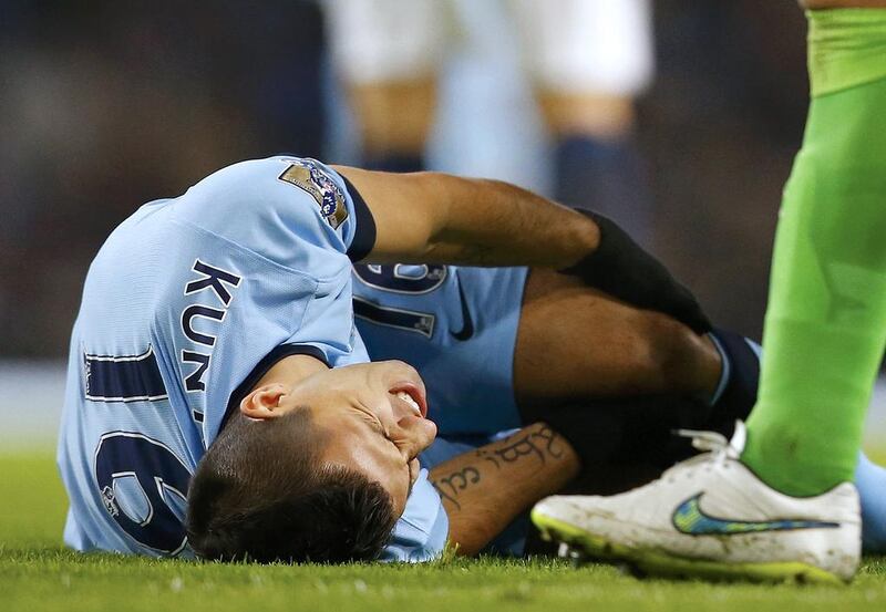 Sergio Aguero of Manchester City reacts after sustaining an injury during their English Premier League match against Everton. Reuters