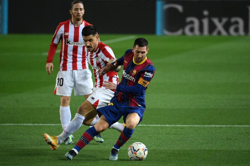 Athletic Bilbao defender Yuri Berchiche challenges Barcelona's Lionel Messi. AFP