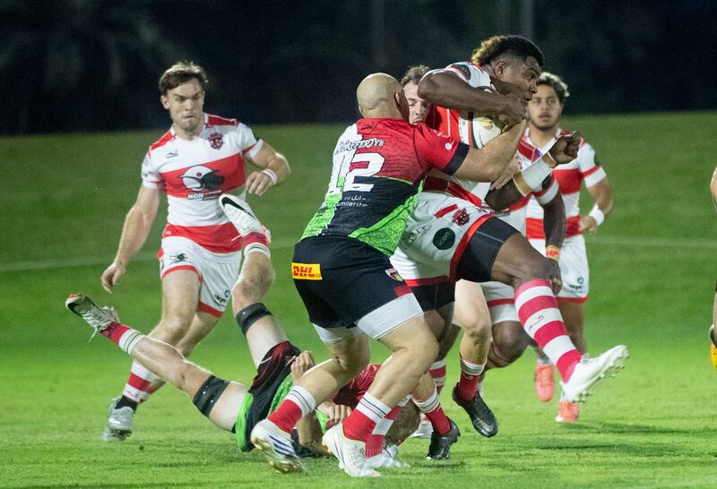Dubai Tigers running with the ball during the West Asia Premiership game against Abu Dhabi Harlequins at Zayed Sports City Rugby Fields.  Ruel Pableo for The National