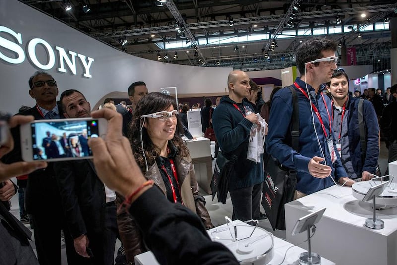 Visitors sample Sony wearable smart glasses. The company also unveiled its new Z4 Android tablet and M4 Aqua smartphone. David Ramos / Getty Images