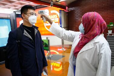 A passenger from Beijing is screened for coronavirus at Hazrat Shahjalal International airport in Dhaka, Bangladesh on Wednesday. AP