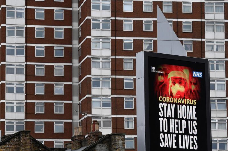 A UK government public health campaign message is displayed on a billboard in West London, as the spread of the coronavirus disease (COVID-19) continues, London, Britain, April 1, 2020. REUTERS/Toby Melville