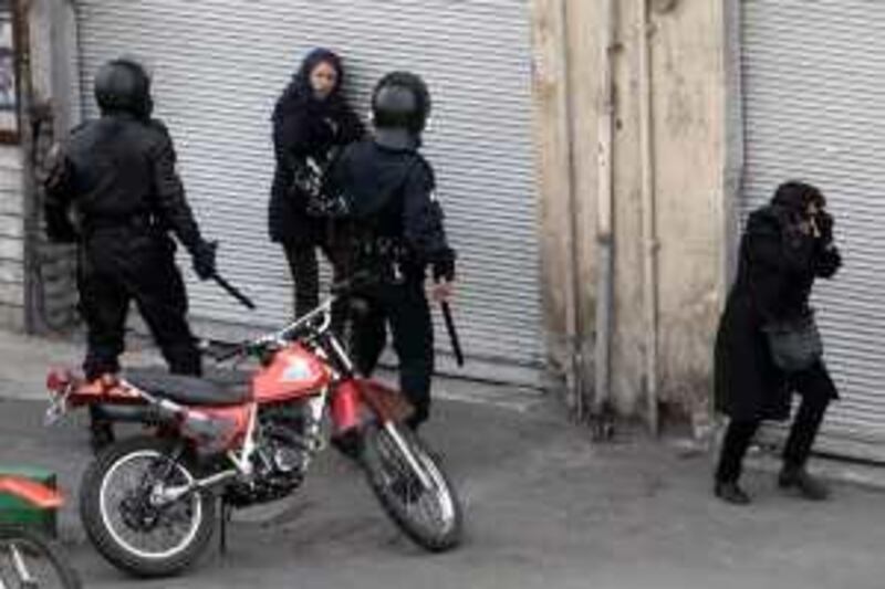 ** EDS NOTE ALTERNATIVE CROP LON413 ** This photo, taken by an individual not employed by the Associated Press and obtained by the AP outside Iran shows Iranian anti-riot police officers on the street during an anti-government protest in Tehran, Iran, Sunday, Dec. 27, 2009. (AP Photo)  EDITORS NOTE AS A RESULT OF AN OFFICIAL IRANIAN GOVERNMENT BAN ON FOREIGN MEDIA COVERING SOME EVENTS IN IRAN, THE AP WAS PREVENTED FROM INDEPENDENT ACCESS TO THIS EVENT *** Local Caption ***  LON413_Mideast_Iran_.jpg