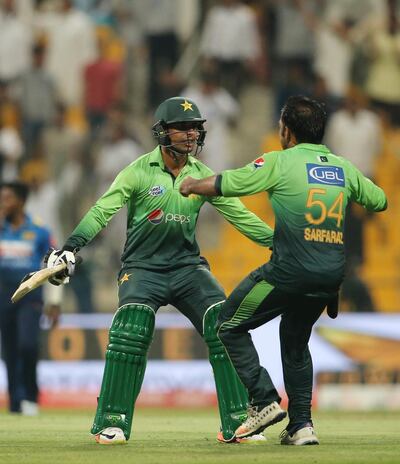 Pakistan's Shadab Khan celebrates with Sarfaraz Ahmed after they beat Sri Lanka during their second day of T20 cricket match in Abu Dhabi, United Arab Emirates, Friday, Oct. 27, 2017. (AP Photo/Kamran Jebreili)