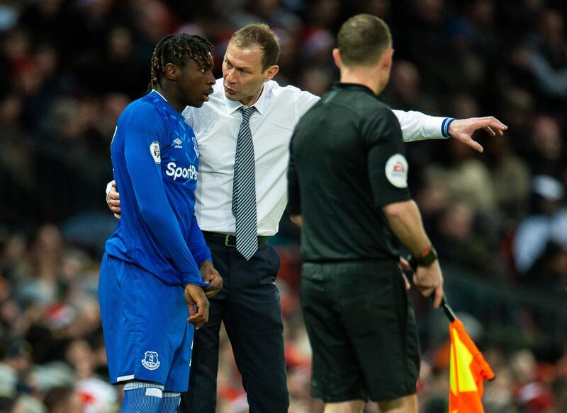 Everton caretaker manager Duncan Ferguson gives substitute Moise Kean instructions. EPA