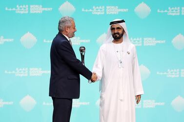 Crown Prince of Dubai and Vice President of the UAE Sheikh Mohammed bin Rashid presents Dr Ferozuddin Feroz, Public Health Minister of Afghanistan, with the best minister award at the World Government Summit in Dubai. Chris Whiteoak / The National