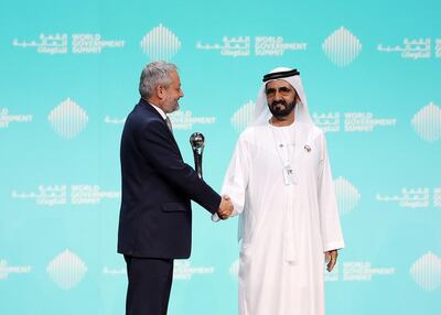 Crown Prince of Dubai and Vice President of the UAE Sheikh Mohammed bin Rashid presents Dr Ferozuddin Feroz, Public Health Minister of Afghanistan, with the best minister award at the World Government Summit in Dubai. Chris Whiteoak / The National