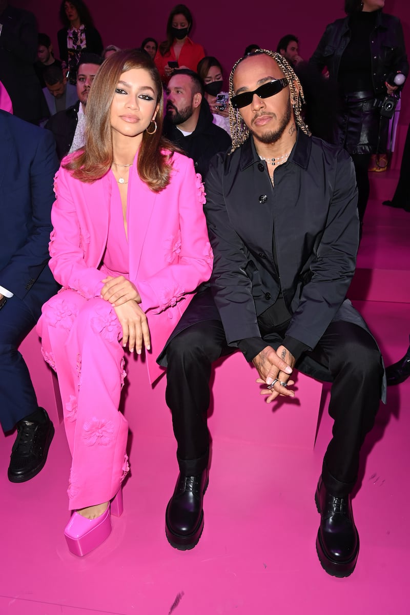 Zendaya and Lewis Hamilton, in head-to-toe black Valentino, attend the Valentino show as part of Paris Fashion Week on March 6, 2022. Getty Images