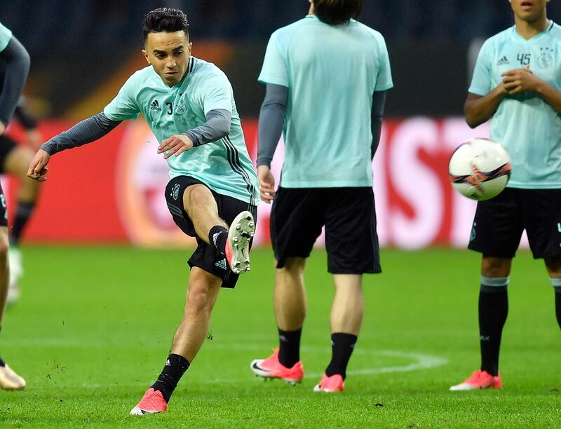 FILE - This is a Tuesday, May 23, 2017  file photo of Ajax's Abdelhak Nouri as he kicks a ball during a training session at the Friends Arena in Stockholm, Sweden. Ajax midfielder Abdelhak Nouri who collapsed due to an irregular heartbeat during a friendly game in Austria on Saturday July 8, 2017 has suffered "severe and permanent brain damage." The Dutch club says "it received very bad news regarding the condition of Abdelhak Nouri" after doctors at a hospital in Innsbruck woke up the player from an induced coma. (AP Photo/Martin Meissner/File)