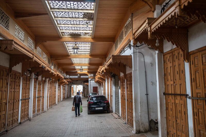 A man walks past closed shops before the start of Ramadan in the usually bustling Medina of Rabat, Morocco, Thursday, April 23, 2020. AP Photo