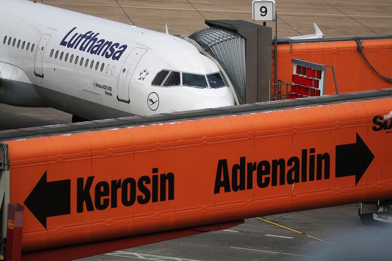 An Airbus SE A321 passenger aircraft, operated by Deutsche Lufthansa AG, sits connected to a jet bridge at Tegel airport in Berlin, Germany, on Monday, July 29, 2019. Deutsche Lufthansa AG is considering a shift to a corporate holding structure, seeking to streamline Europe's biggest airline group as it fights for market share. Photographer: Krisztian Bocsi/Bloomberg