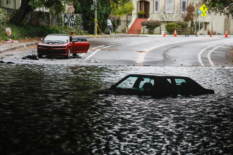 Cars stuck in a flooded underpass in Oakland. AP